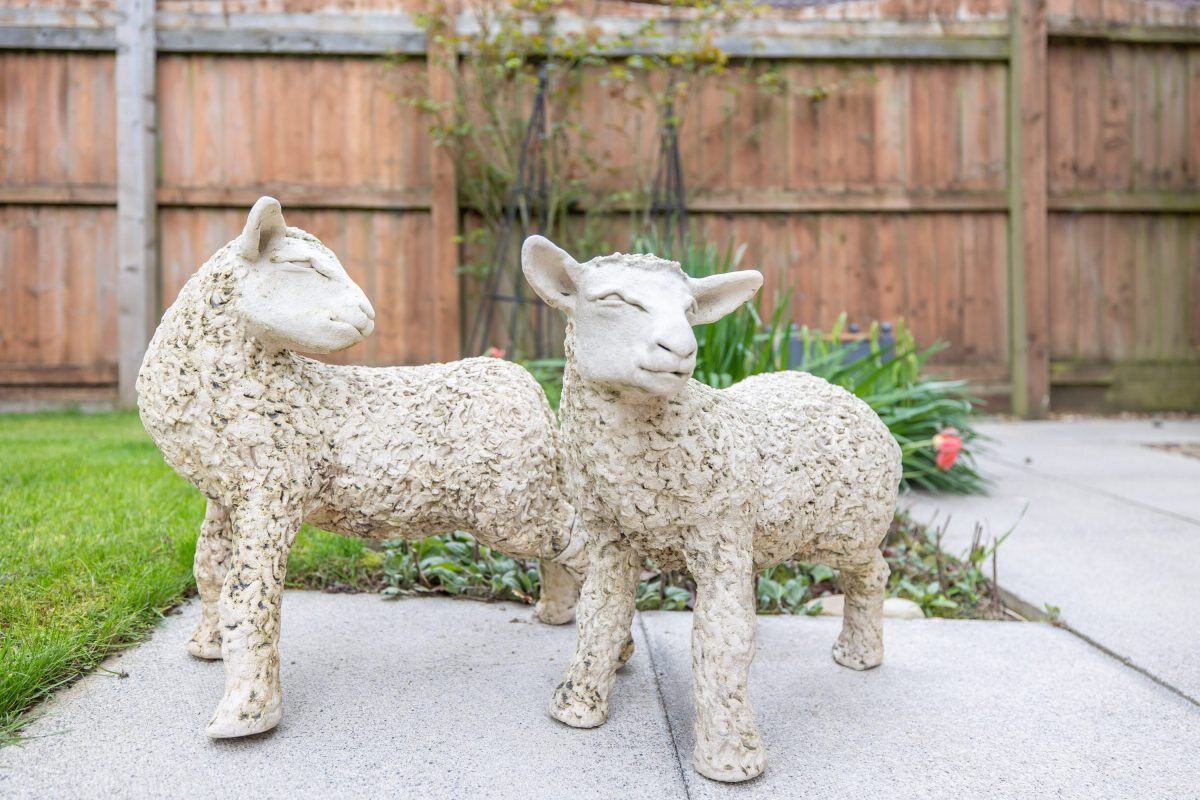 The ceramic sheep guardians in the garden at Pinfold Gardens